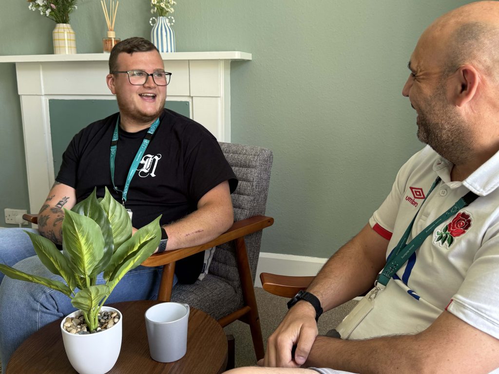 Two wellbeing coordinators chat in an Access Wellbeing hub